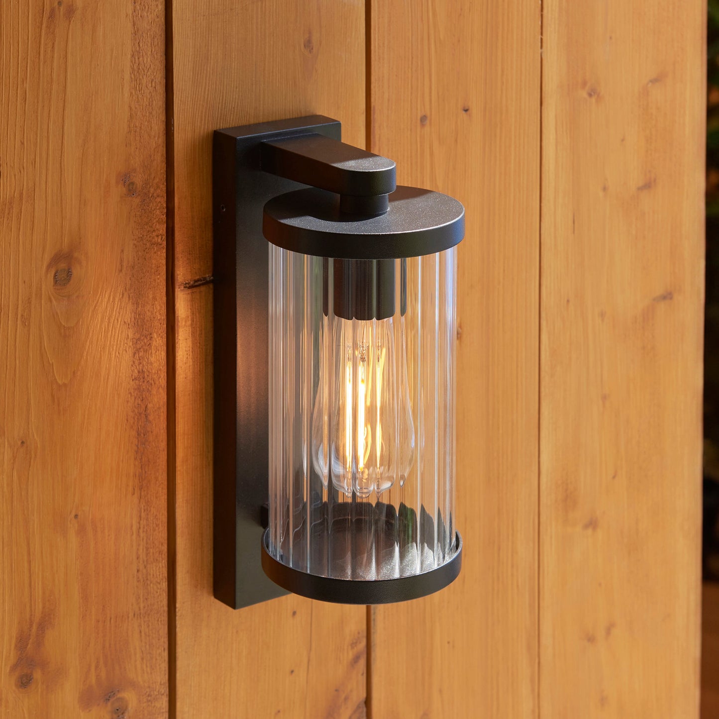 Outdoor Wall Light with Integrated PIR in Black with Ribbed Glass - ID 13968
