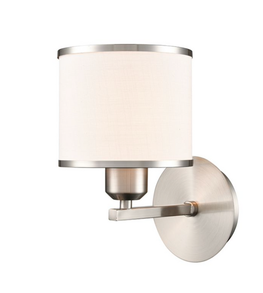 A modern wall-mounted sconce with a cylindrical off-white fabric shade and brushed nickel metal hardware, shown against a plain white background.