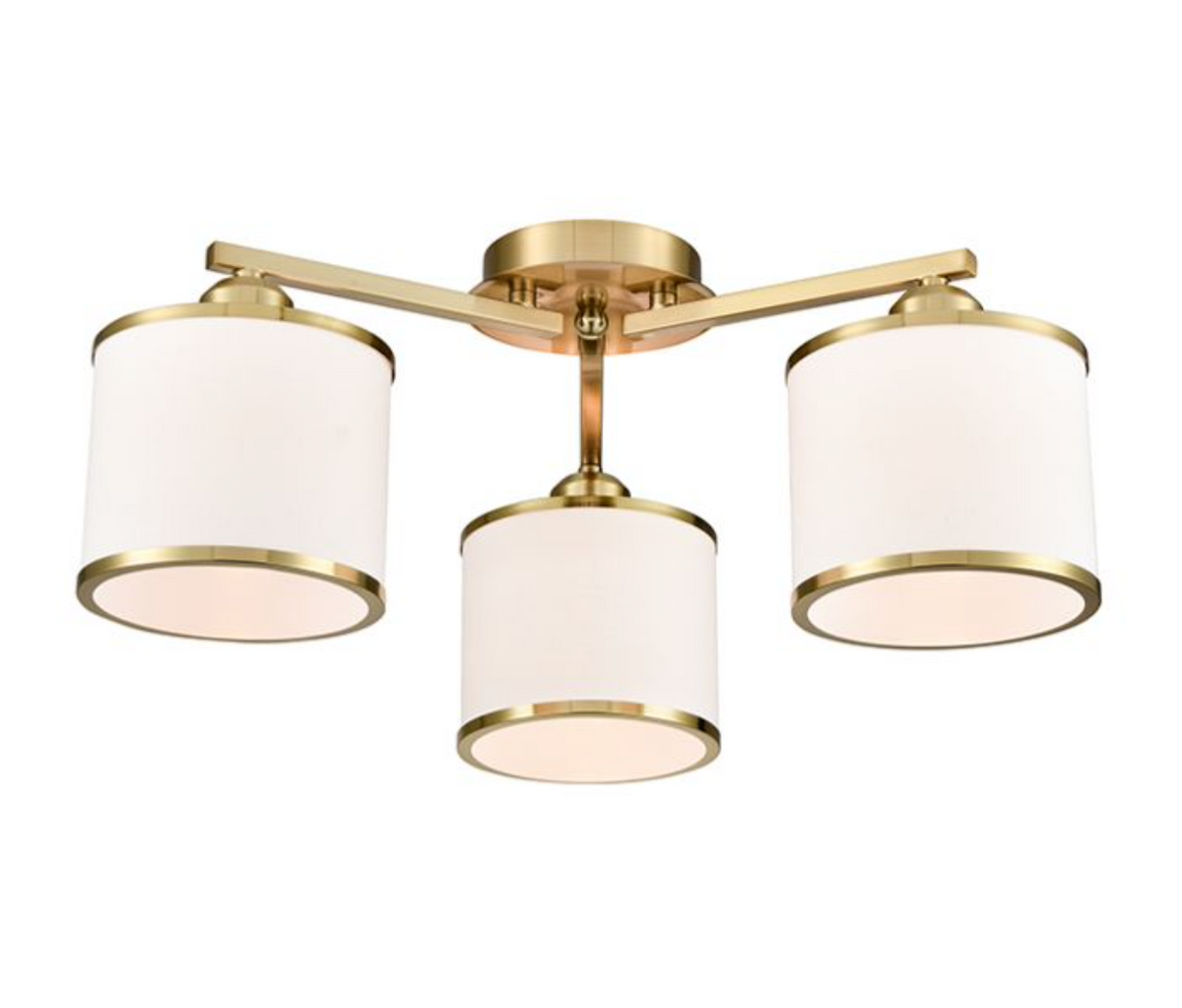 A modern three-light ceiling fixture with a brushed gold metal frame and cylindrical white fabric shades, shown against a plain white background.