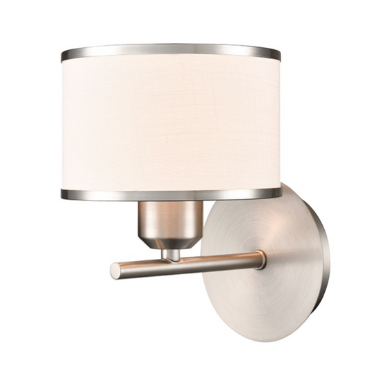A modern wall-mounted light fixture with a cylindrical off-white fabric shade, brushed silver metal top and bottom trim, and a horizontal bar with a round backplate in a brushed nickel finish.