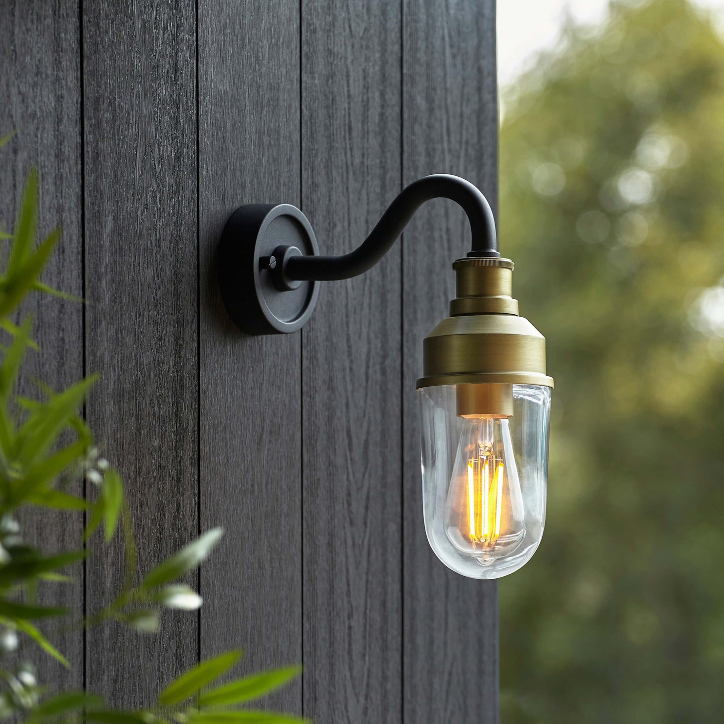 Matt Antique Brass Curved Arm Wall Light With Clear Glass  - ID 12497