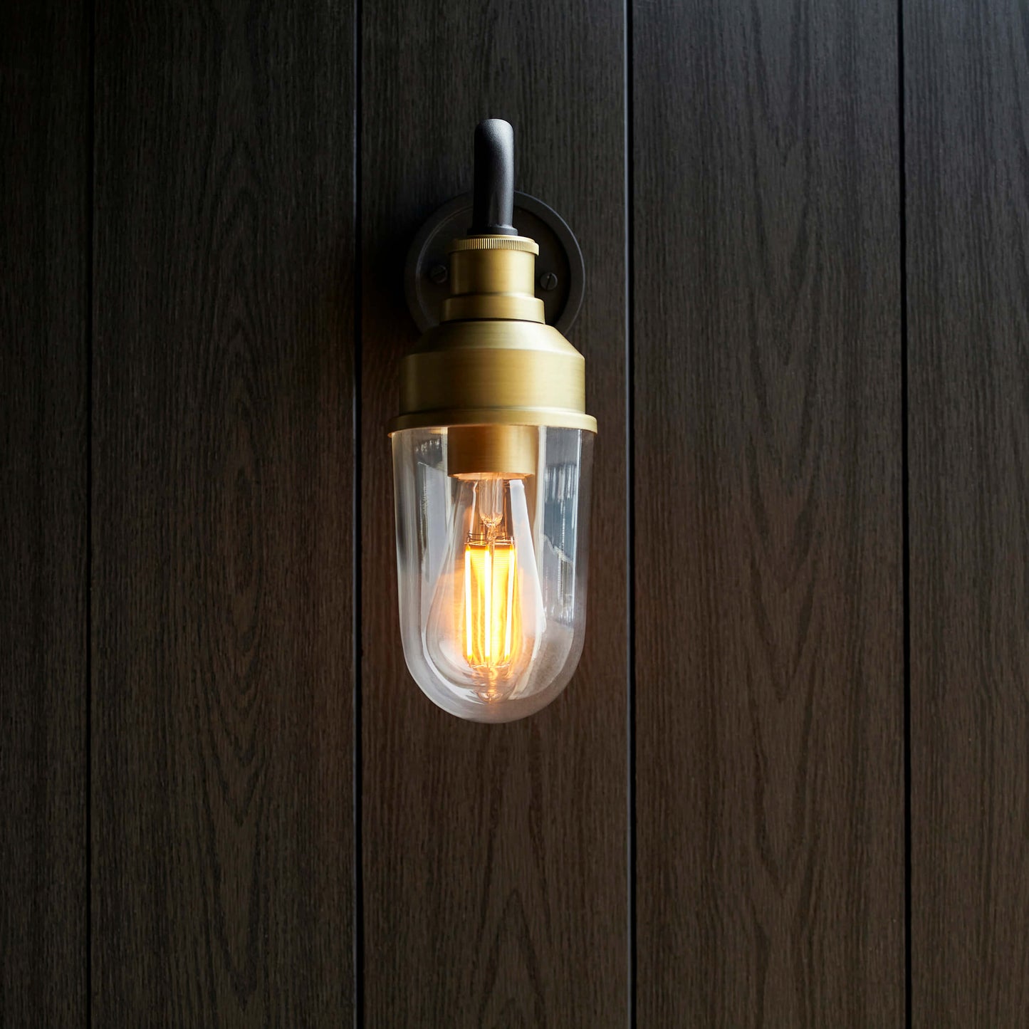 Matt Antique Brass Curved Arm Wall Light With Clear Glass  - ID 12497